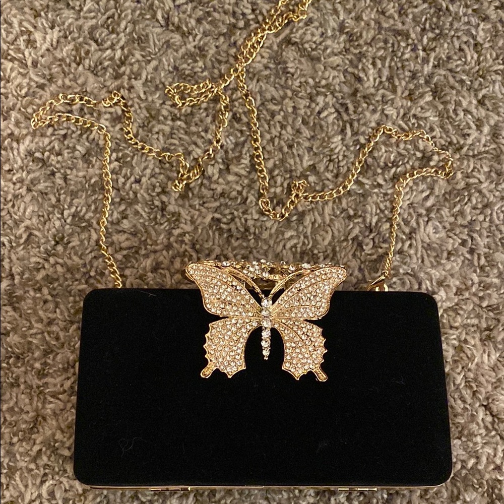 Elegant Black Clutch with Gold Butterfly Accent